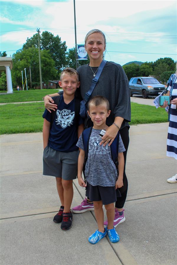 Students walking in on the first day of school. 